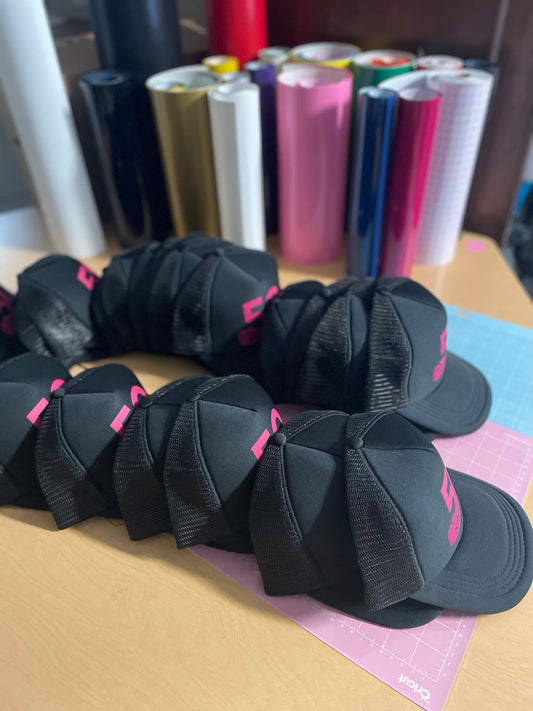 black custom trucker hats collection and colorful vinyl rolls for decal production showcasing EcoRootStore's product range