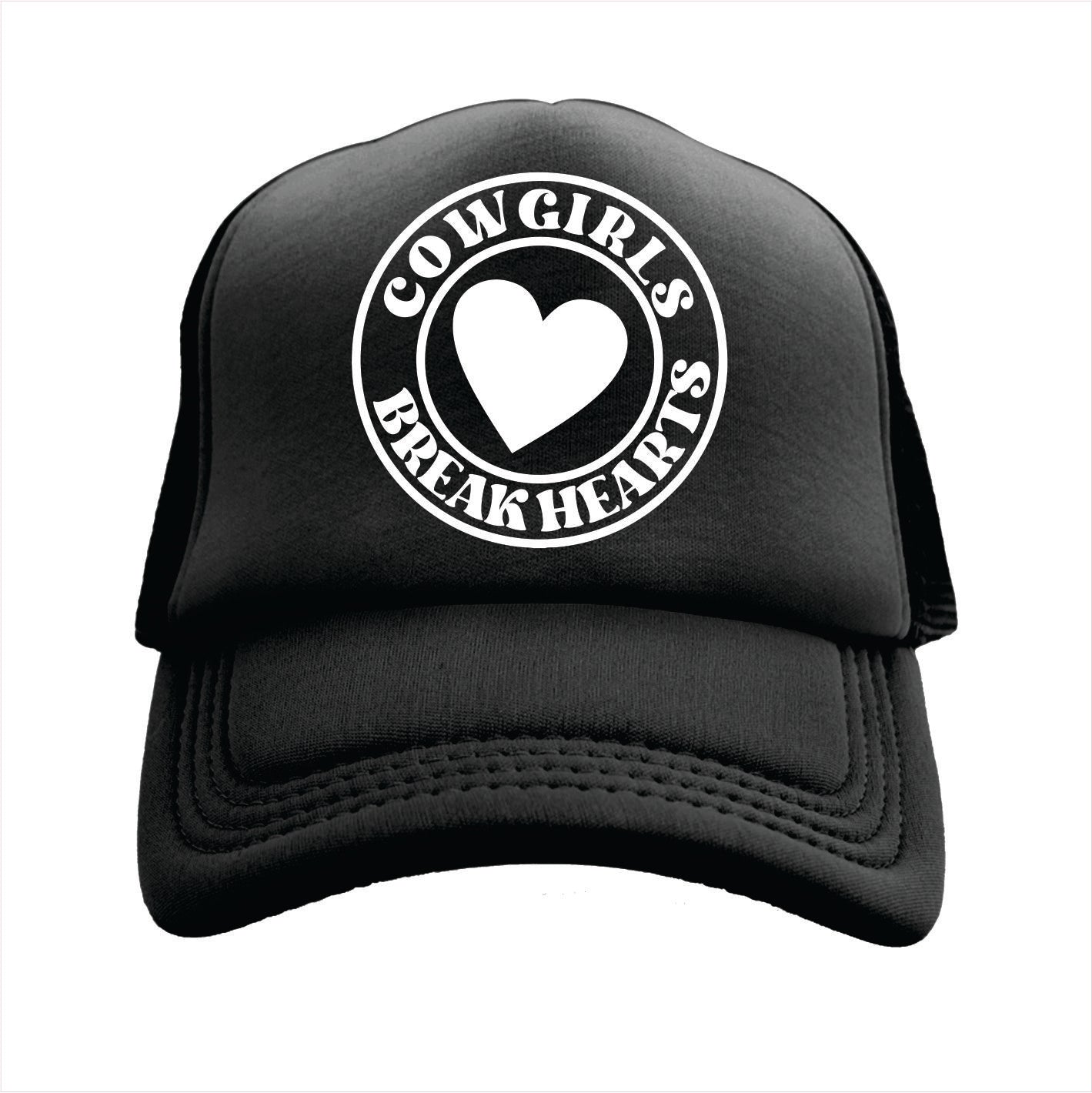 Black trucker hat cap with 'COWGIRLS BREAK HEARTS' text and a heart symbol printed on the front.