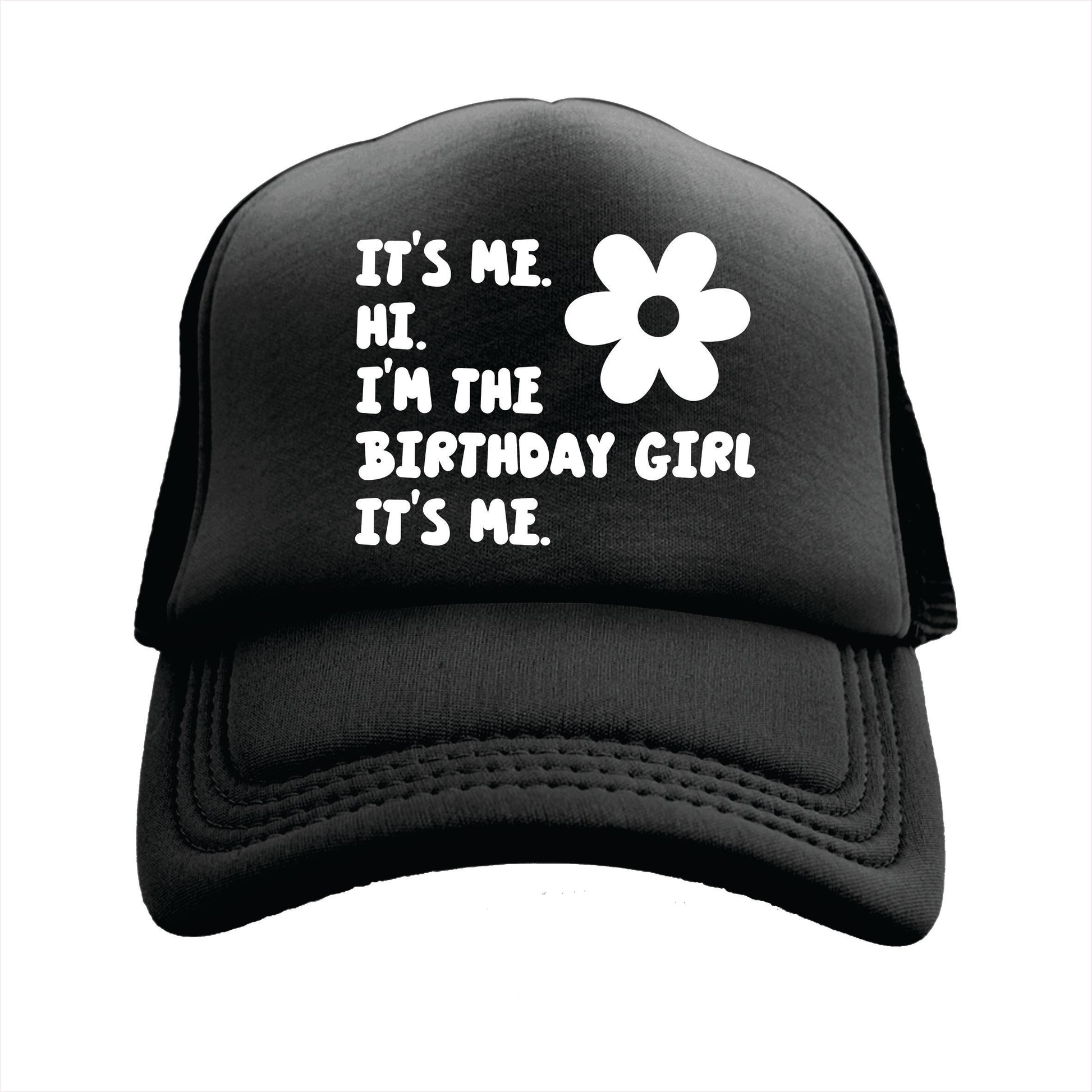 Black trucker hat cap with text 'IT'S ME. HI. I'M THE BIRTHDAY GIRL IT'S ME.' printed on the front.