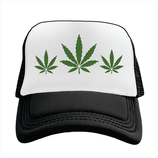 Black and white trucker hat cap with green cannabis leaves on a white background