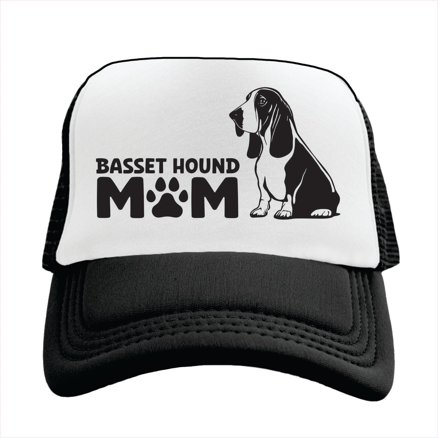 Black and white trucker hat cap with 'Basset Hound Mom' text and basset hound graphic on a white background