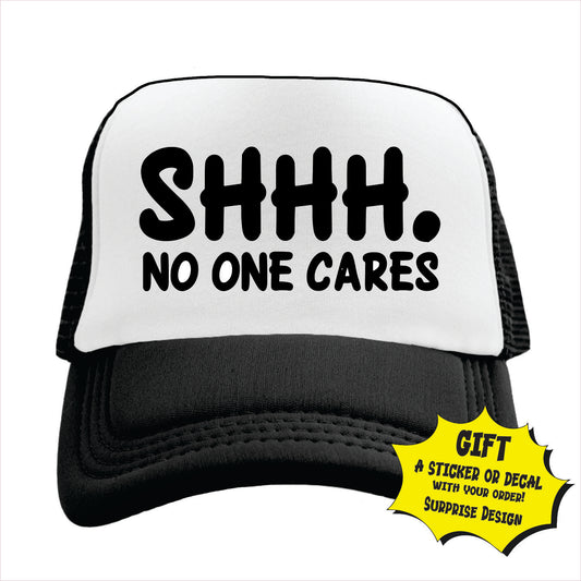 Black and white trucker hat cap with 'SHHH. NO ONE CARES' text on a white background