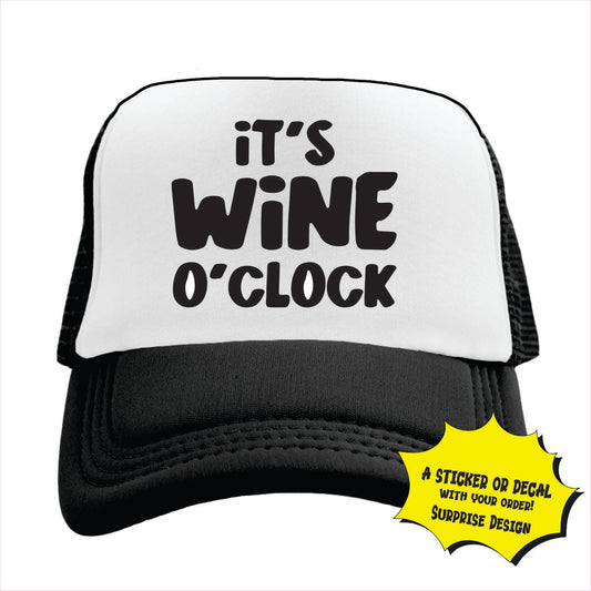 Black and white trucker hat cap with black text 'IT'S WINE O' CLOCK' on the front panel.