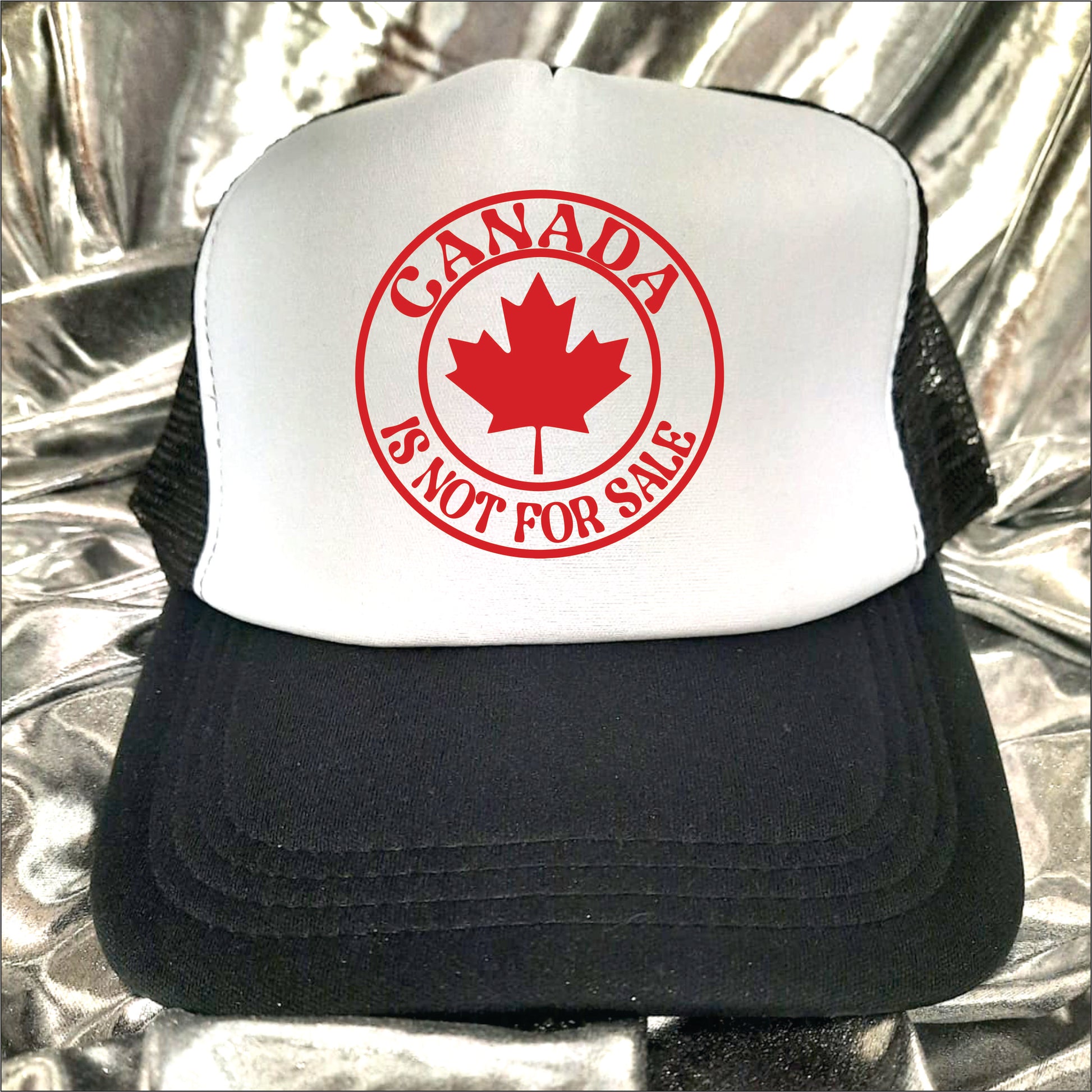 Black and white trucker hat cap with the text 'Canada is not for sale'.