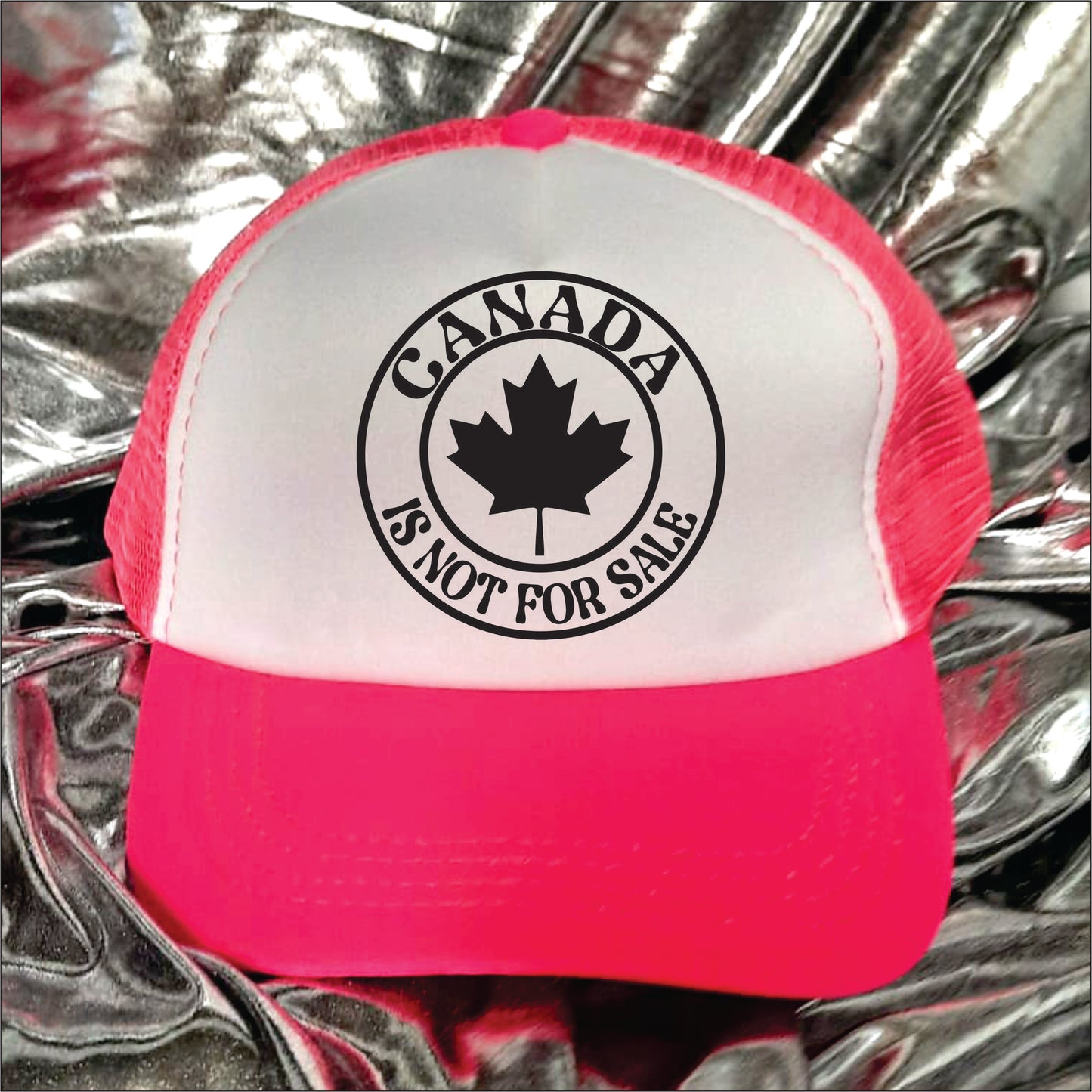 Pink and white trucker hat cap with the text 'Canada is not for sale'.