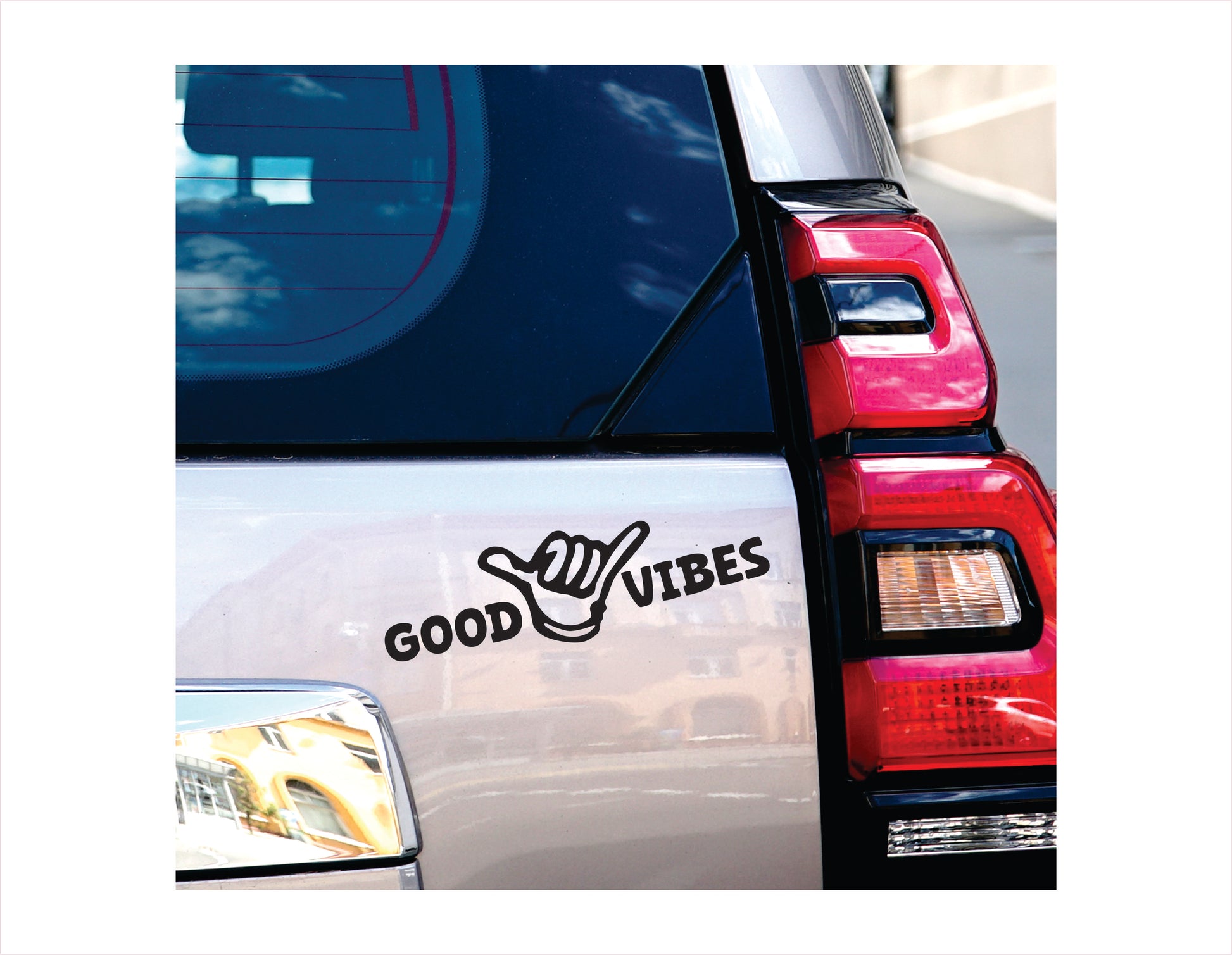 Car with 'Good Vibes' decal on the back