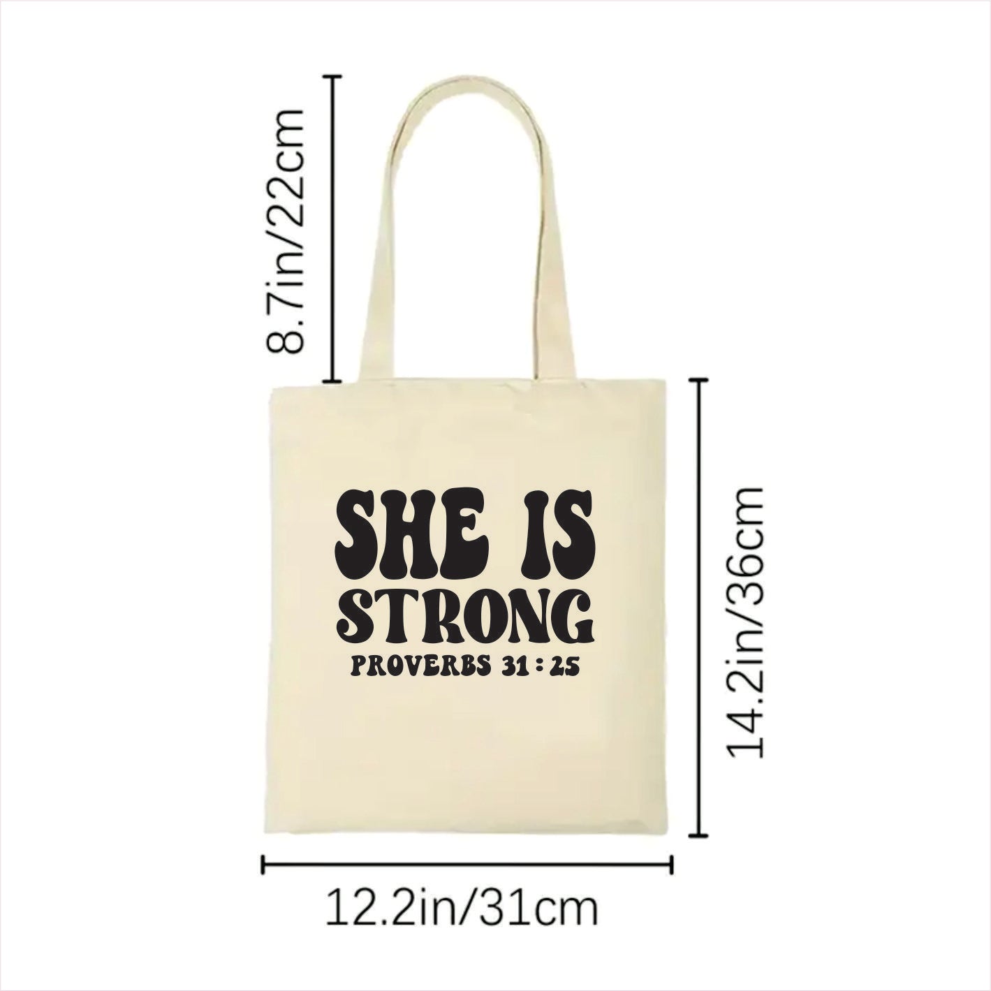 white tote bag with 'SHE IS STRONG' text and measurements on a white background