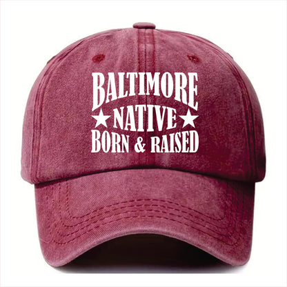 Burgundy cap with 'Baltimore Native Born & Raised' text on a white background