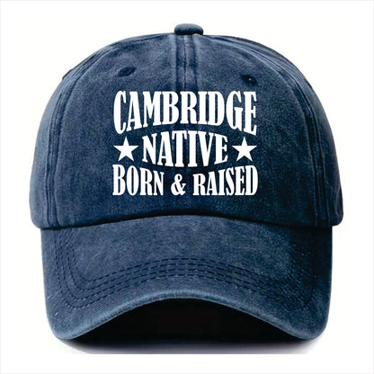 Blue cap with 'Cambridge Native Born & Raised' text on a white background