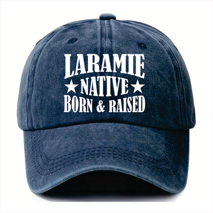 Blue cap with 'Laramie Native Born & Raised' text on a white background