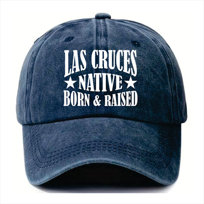 Blue cap with 'Las Cruces Native Born & Raised' text on a white background