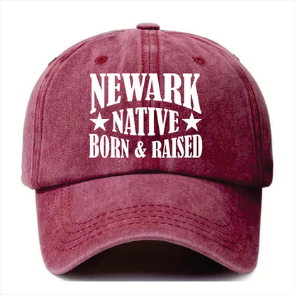 Burgundy cap with 'Newark Native Born & Raised' text on a white background