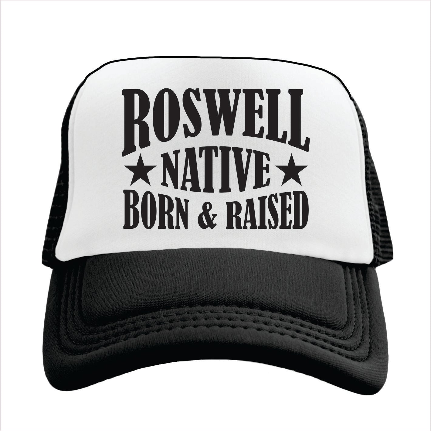 Black and white cap with 'Roswell Native Born & Raised' text on a white background