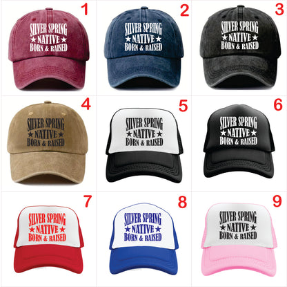 Nine baseball caps with 'Silver Spring Native Born & Raised' text in various colors and styles.