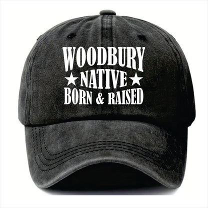 Black cap with 'Woodbury Native Born & Raised' text on a white background