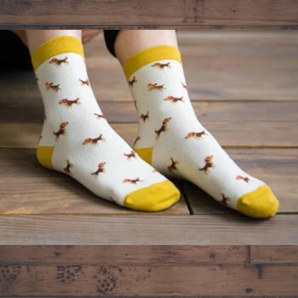 feet wearing a pair of socks with beagle design