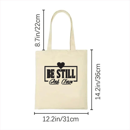 Beige tote bag with text and measurements on a white background