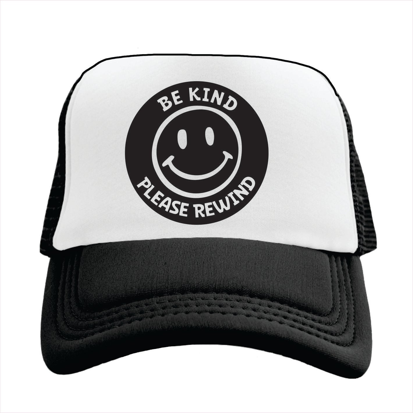 Black and white trucker hat with a round black featuring a smiley face and the text 'BE KIND PLEASE REWIND' on the front.