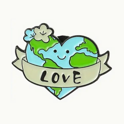 enamel pin with a happy heart shaped earth saying love