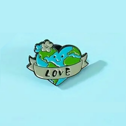 enamel pin with a happy heart shaped earth saying love