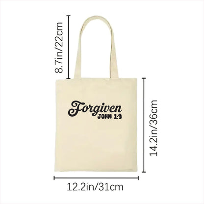 white  tote bag with 'Forgiven John 1:9' text and measurements on a white background