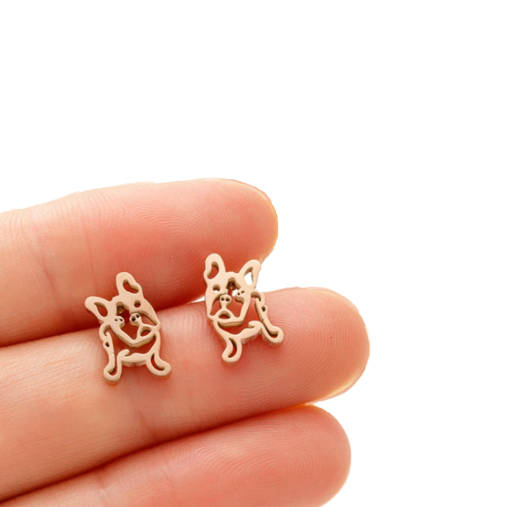 French Bulldog stud earrings between 2 fingers