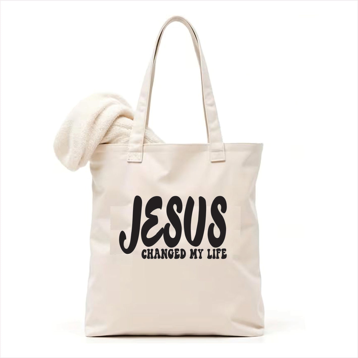 white tote bag with 'JESUS CHANGED MY LIFE' text on a white background