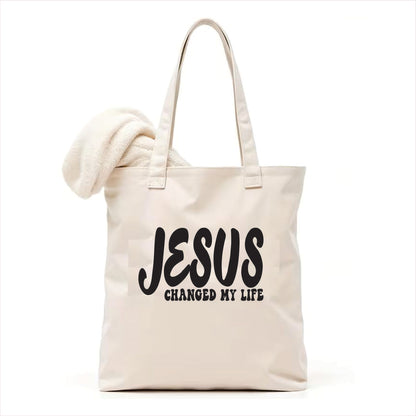 white tote bag with 'JESUS CHANGED MY LIFE' text on a white background