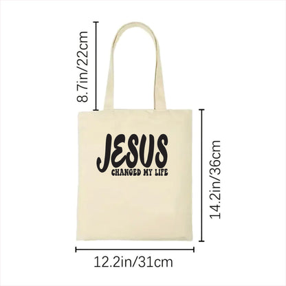 white tote bag with 'Jesus Changed My Life' text and measurements on a white background