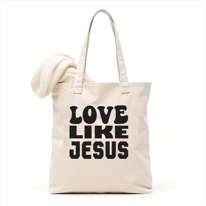 white tote bag with 'Love Like Jesus' text on a white background