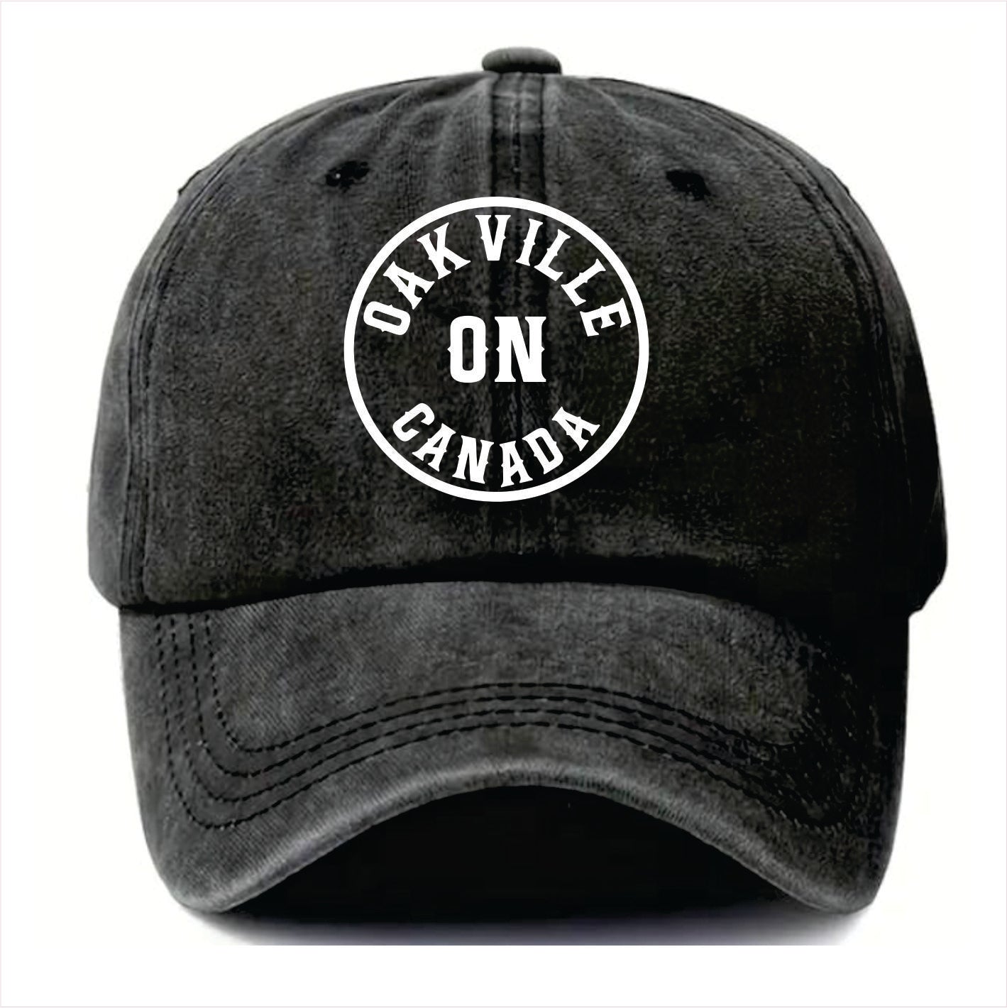 Black cap with 'Oakville ON Canada' text on a white background