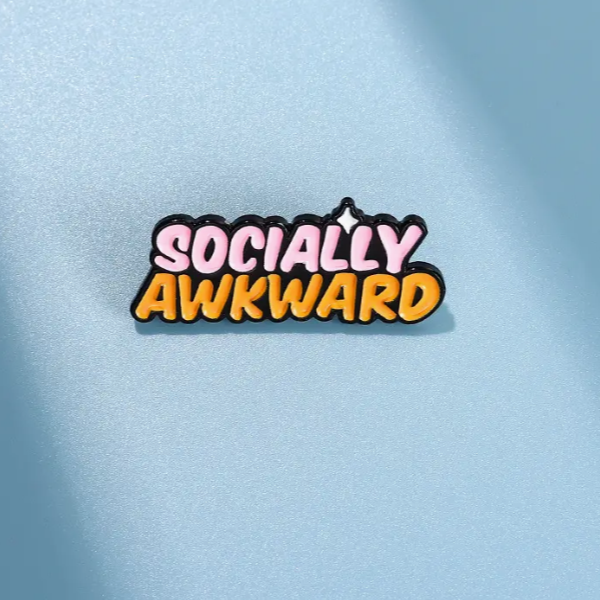 enamel pin saying Socially Awkward