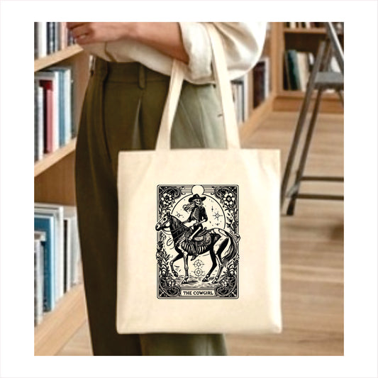 The cowgirl tarot skull tote bag