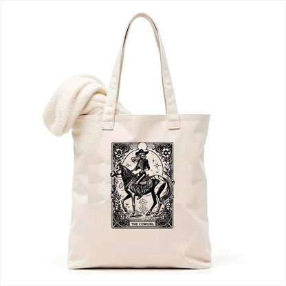 The cowgirl tarot skull tote bag