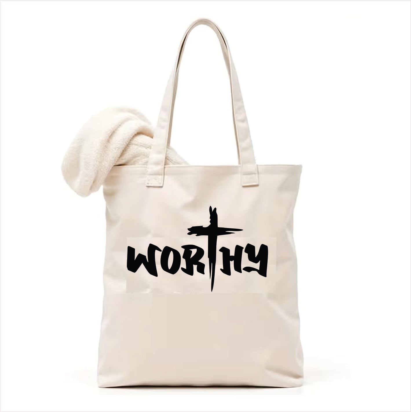 white tote bag with 'WORTHY' text and cross design on a white background